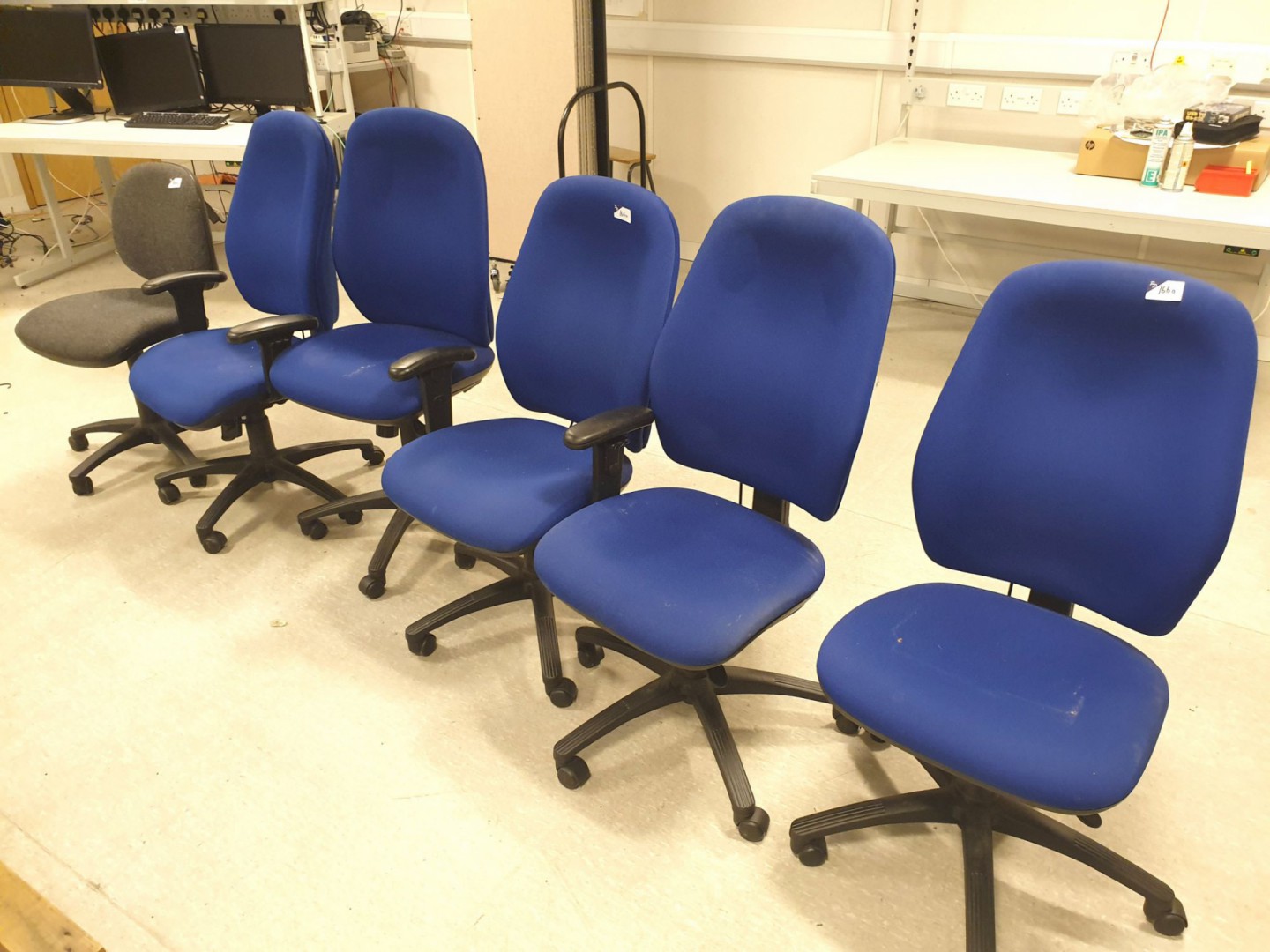 5x blue upholstered swivel office chairs, 1x grey...
